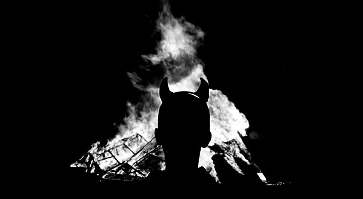 Joyrider. Youth in front of bonfire.